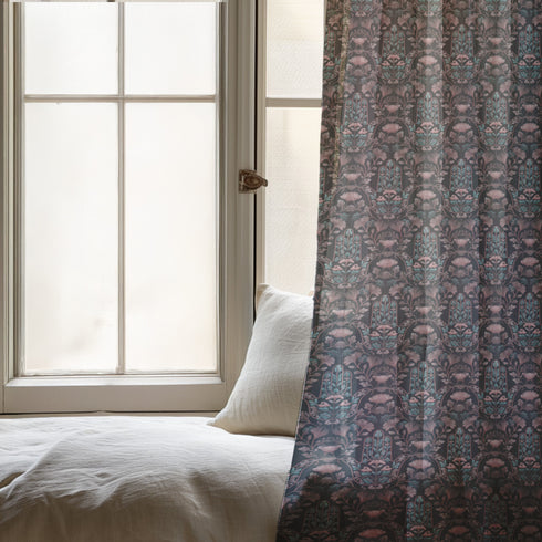 Sheer curtain panel featuring repeating teal hamsa hands with blush pink floral elements on dark gray background. Linen-textured polyester fabric allows filtered light while providing elegant window covering with protective symbolism for bohemian or vintage decor.